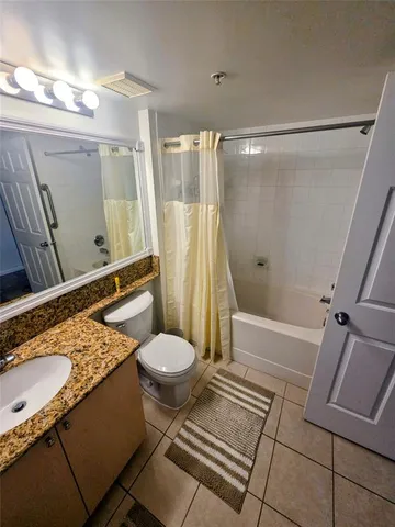 a view of a hallway and wooden floor