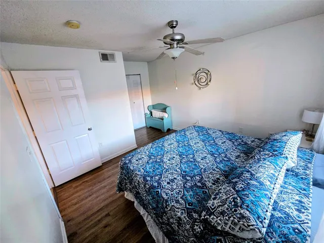 a view of a hallway view with wooden floor and furniture
