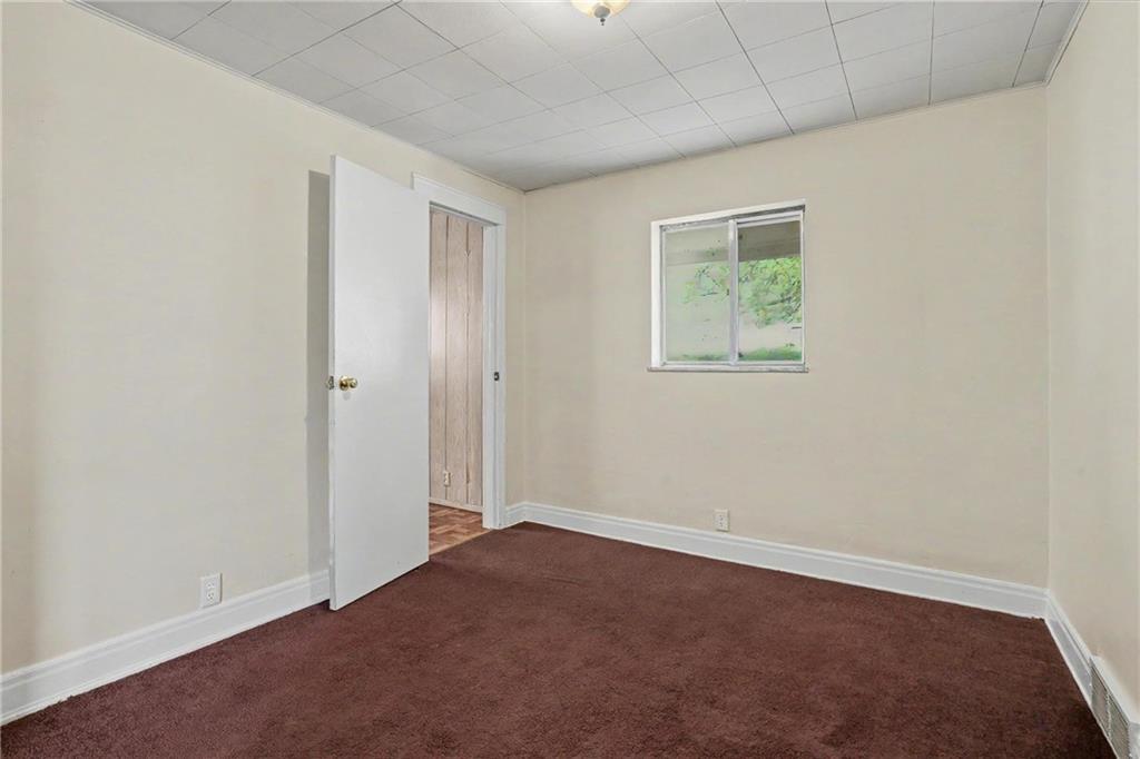 218 Vine Street Homestead, PA 15120 - Photo 12 of 36 an empty room with windows