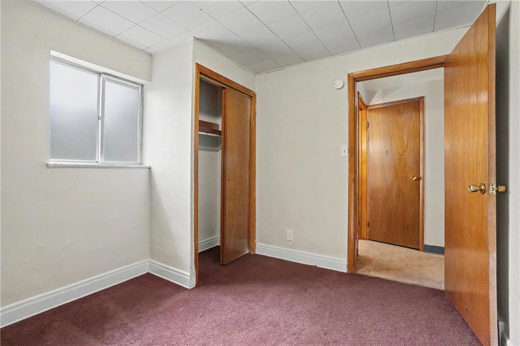 218 Vine Street Homestead, PA 15120 - Photo 16 of 36 an empty room with closet and mirror