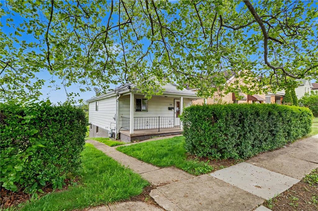 218 Vine Street Homestead, PA 15120 - Photo 26 of 36 front view of a house with a yard