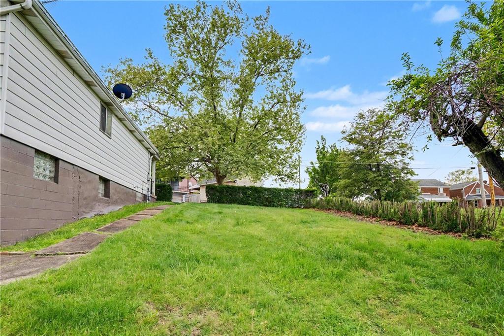 218 Vine Street Homestead, PA 15120 - Photo 29 of 36 a backyard of a house with lots of green space