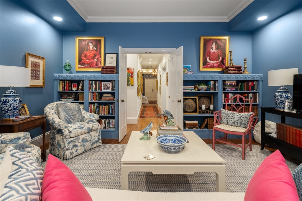 314 Dartmouth Street, Unit B Boston, MA 02116 - Photo 19 of 34 a living room with furniture and book shelf