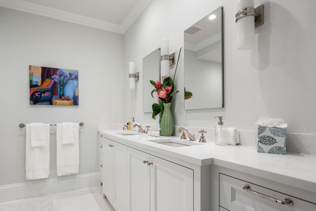 314 Dartmouth Street, Unit B Boston, MA 02116 - Photo 22 of 34 a bathroom with a sink and a mirror