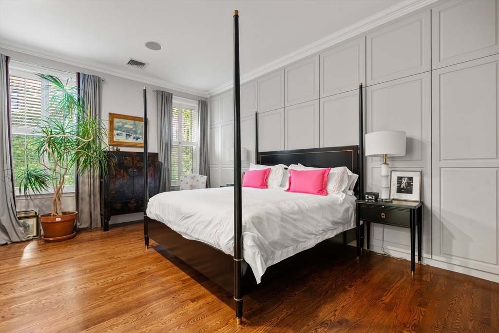 314 Dartmouth Street, Unit B Boston, MA 02116 - Photo 24 of 34 a bedroom with a bed and a potted plant