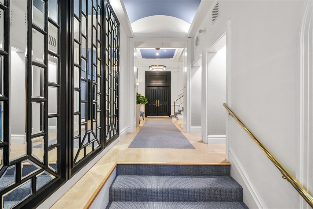 314 Dartmouth Street, Unit B Boston, MA 02116 - Photo 30 of 34 a view of a hallway with wooden floor and staircase
