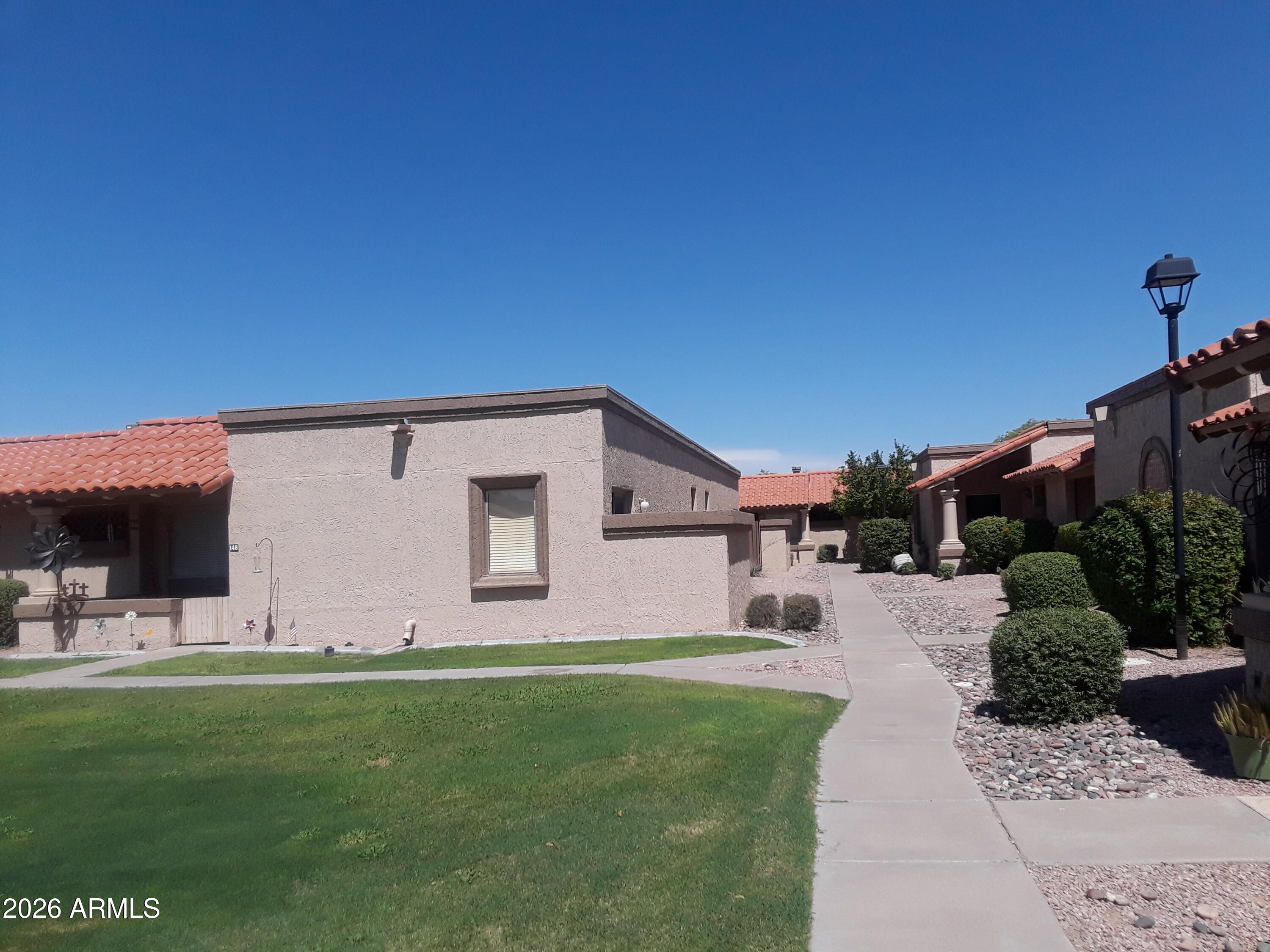 99 North Cooper Road, Unit 138 Chandler, AZ 85225 - Photo 7 of 13 Walkway to #138