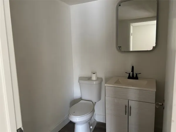 a kitchen with a refrigerator and a sink