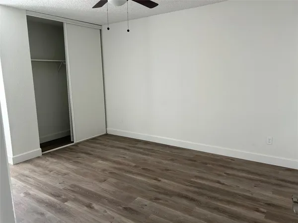 a bathroom with a toilet and a shower curtain