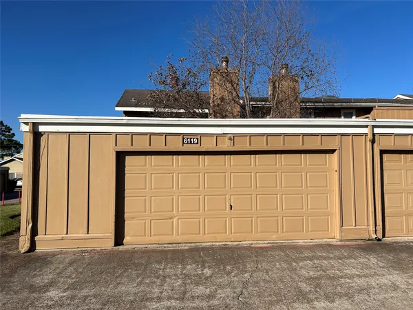 a view of a house with a garage