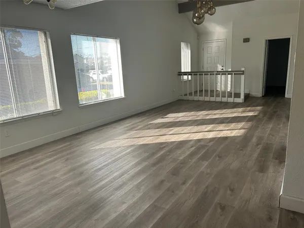 a view of empty room with windows