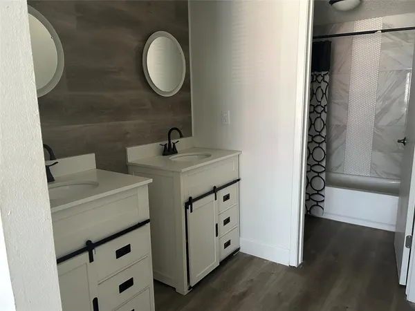 a white toilet sitting next to a bathroom sink