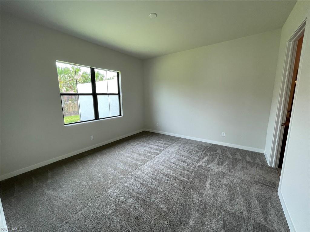 14815 Loggerhead Drive Naples, FL 34120 - Photo 13 of 29 an empty room with windows