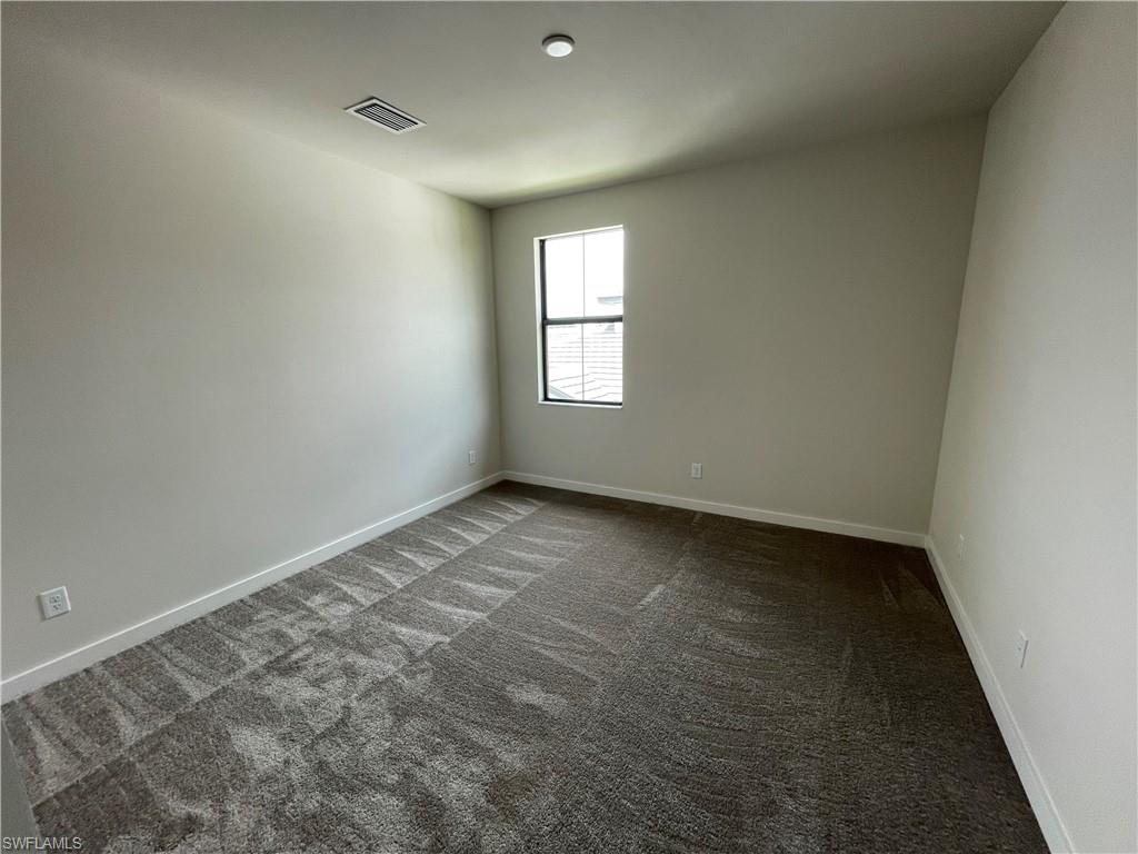 14815 Loggerhead Drive Naples, FL 34120 - Photo 19 of 29 an empty room with a window