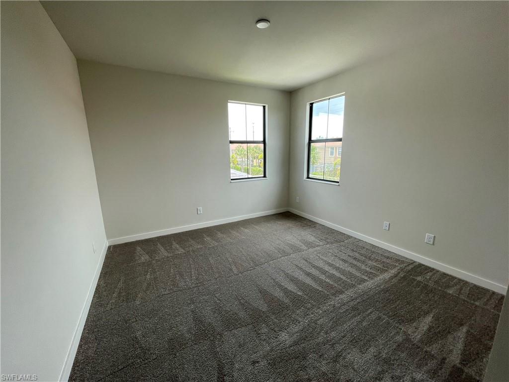 14815 Loggerhead Drive Naples, FL 34120 - Photo 22 of 29 an empty room with windows