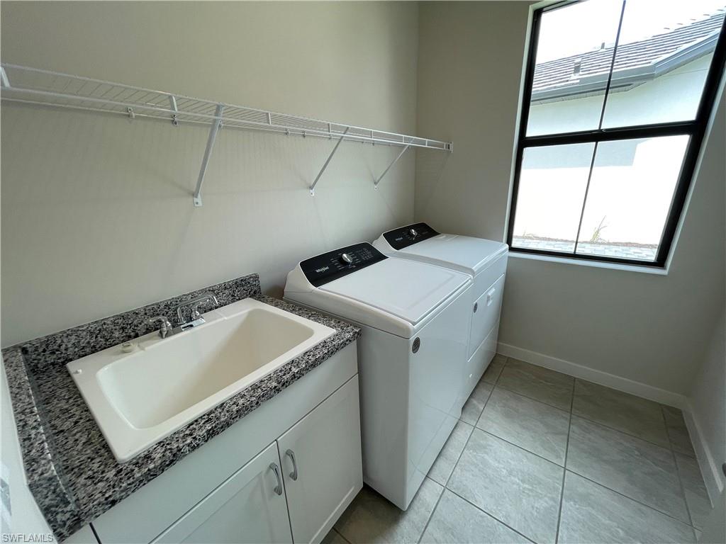 14815 Loggerhead Drive Naples, FL 34120 - Photo 24 of 29 a utility room with dryer and washer