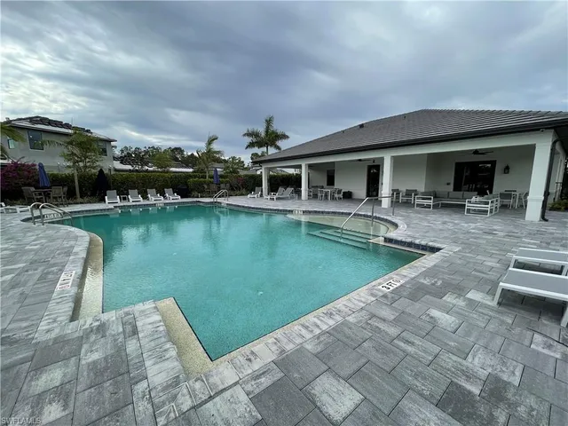 a view of a swimming pool with a patio