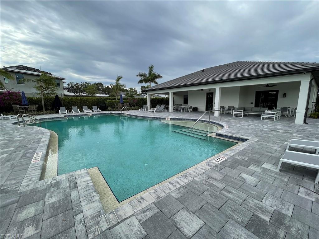 14815 Loggerhead Drive Naples, FL 34120 - Photo 27 of 29 a view of a swimming pool with a patio