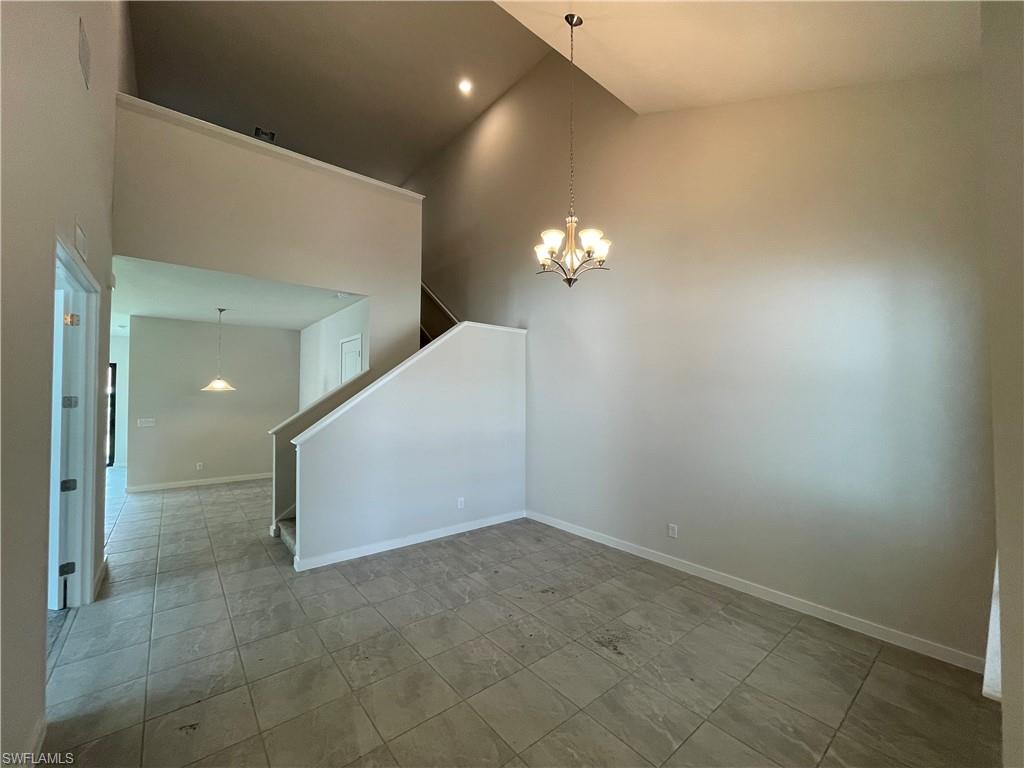 14815 Loggerhead Drive Naples, FL 34120 - Photo 9 of 29 a view of a hallway with chandelier
