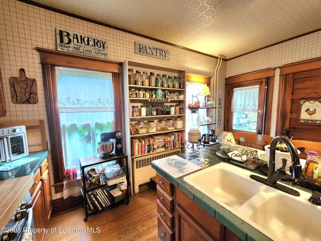 a living room with furniture fireplace and a large window