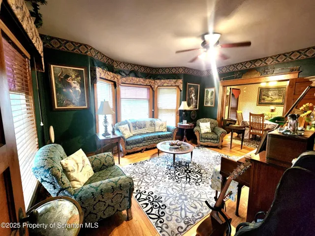 a living room with furniture fireplace and a flat screen tv