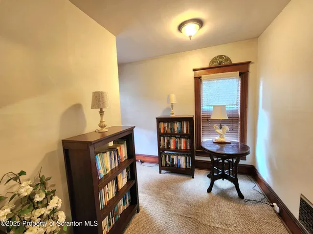a bathroom with a bathtub and a window