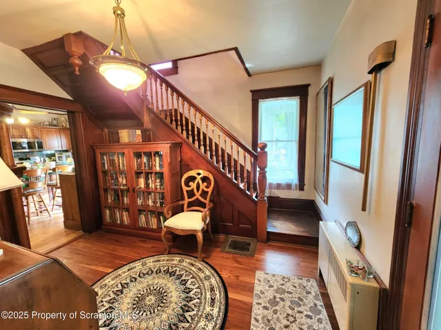 a living room with furniture and a rug