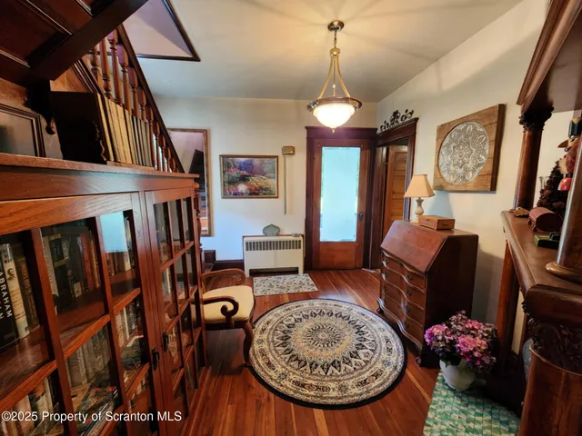 a view of a livingroom with furniture window and wooden floor