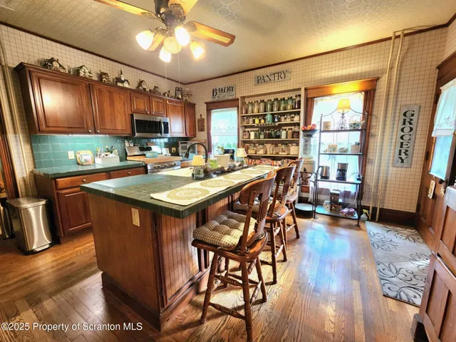 a kitchen with stainless steel appliances granite countertop a stove and a refrigerator