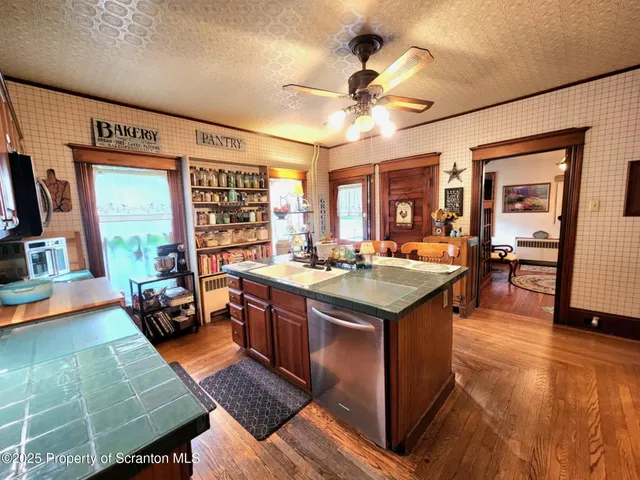 a view of a dining room with furniture and a chandelier