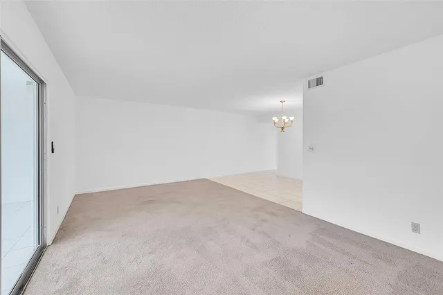 an empty room with glass windows