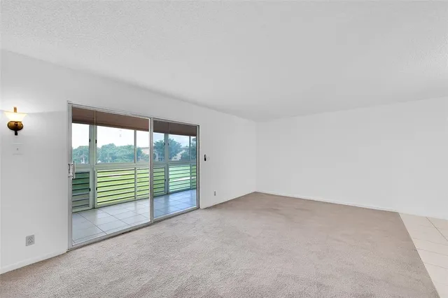 a bathroom with a granite countertop sink mirror a toilet and a mirror