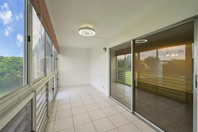 a view of a room with a large window