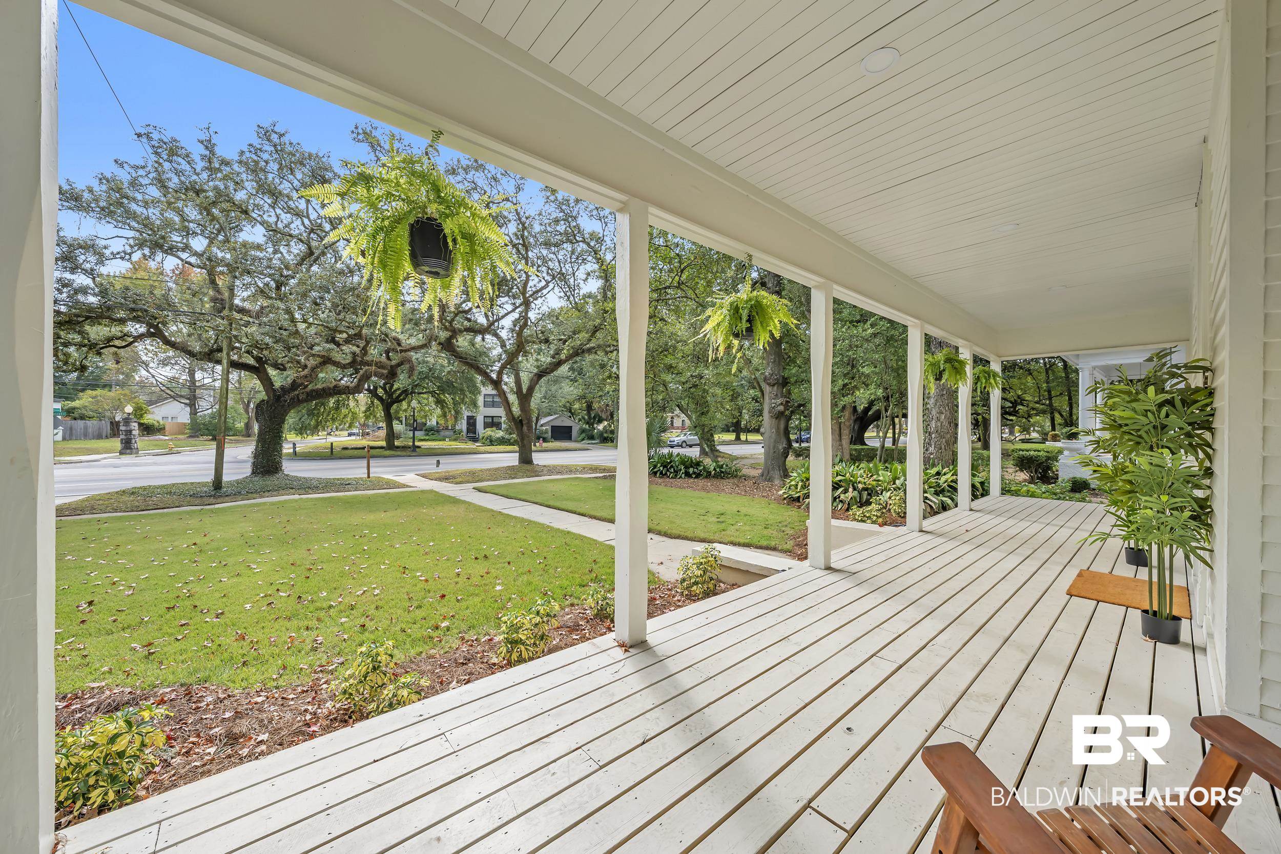 1662 Government Street Mobile, AL 36604 - Photo 4 of 33 Wooden porch with a yard