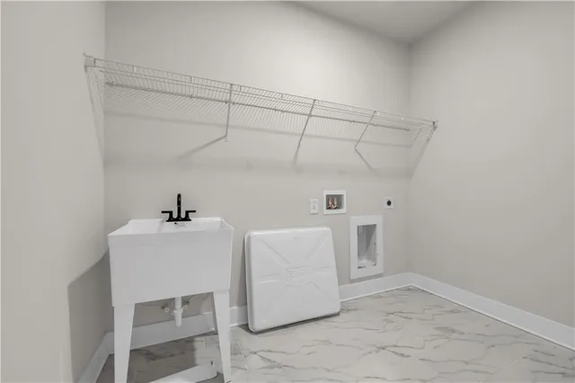 an empty room with ceiling fan and windows