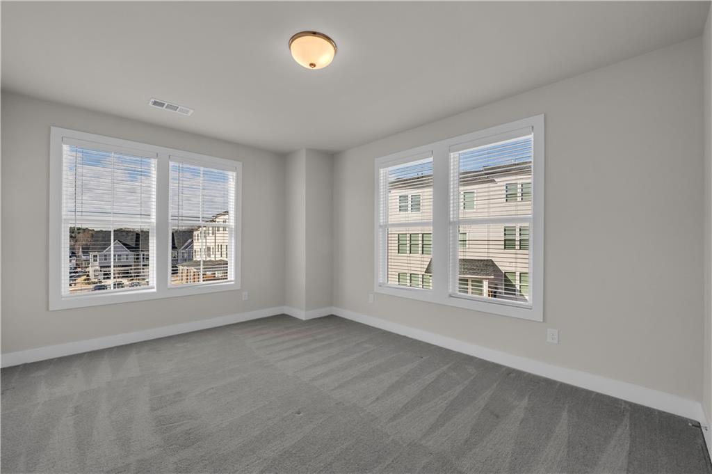 1230 Weatherway Lane Cumming, GA 30041 - Photo 22 of 34 an empty room with a window