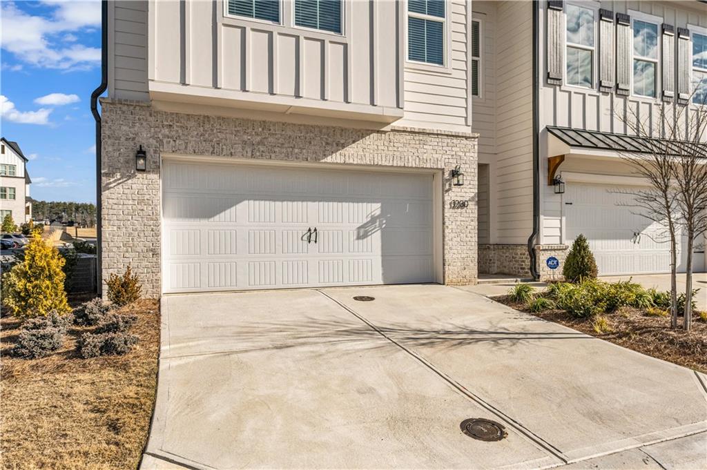 1230 Weatherway Lane Cumming, GA 30041 - Photo 30 of 34 a front view of a house with a yard