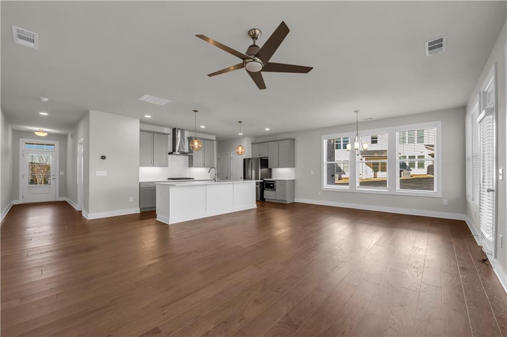 1230 Weatherway Lane Cumming, GA 30041 - Photo 5 of 34 a view of empty room with wooden floor and window
