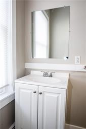 344 Bushkill Street, Unit 2 Easton, PA 18042 - Photo 14 of 30 A well-lit powder room offers a vanity sink with a wall-mounted mirror.