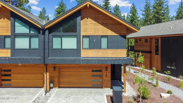 a front view of a house with garage