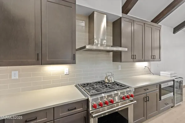 a kitchen with cabinets and stainless steel appliances