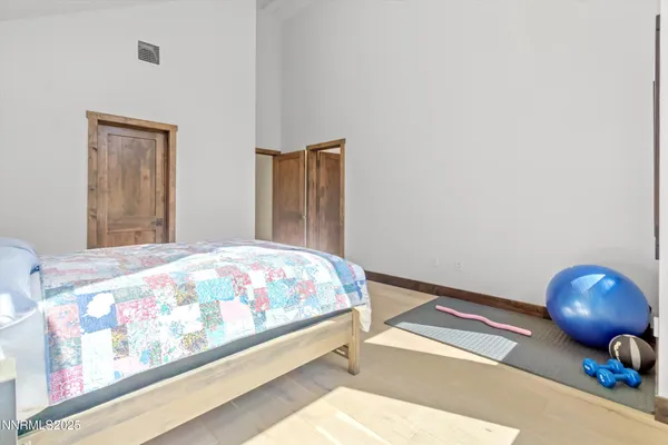 a bedroom with a bed and lamp