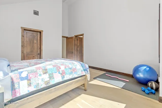 a bedroom with a bed and lamp