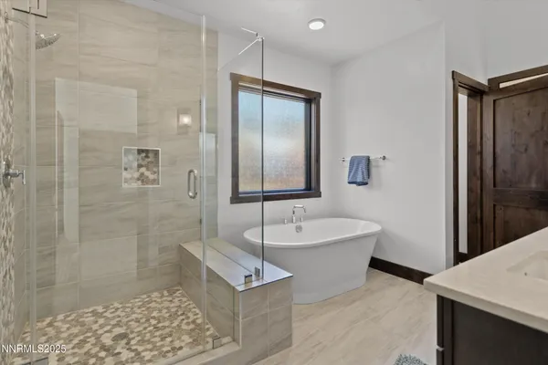 a spacious bathroom with a bathtub shower sink and toilet