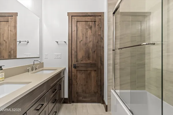 a bathroom with a shower and a sink