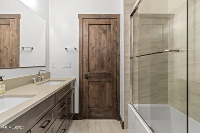 a bathroom with a shower and a sink