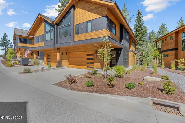 a front view of a house with garage