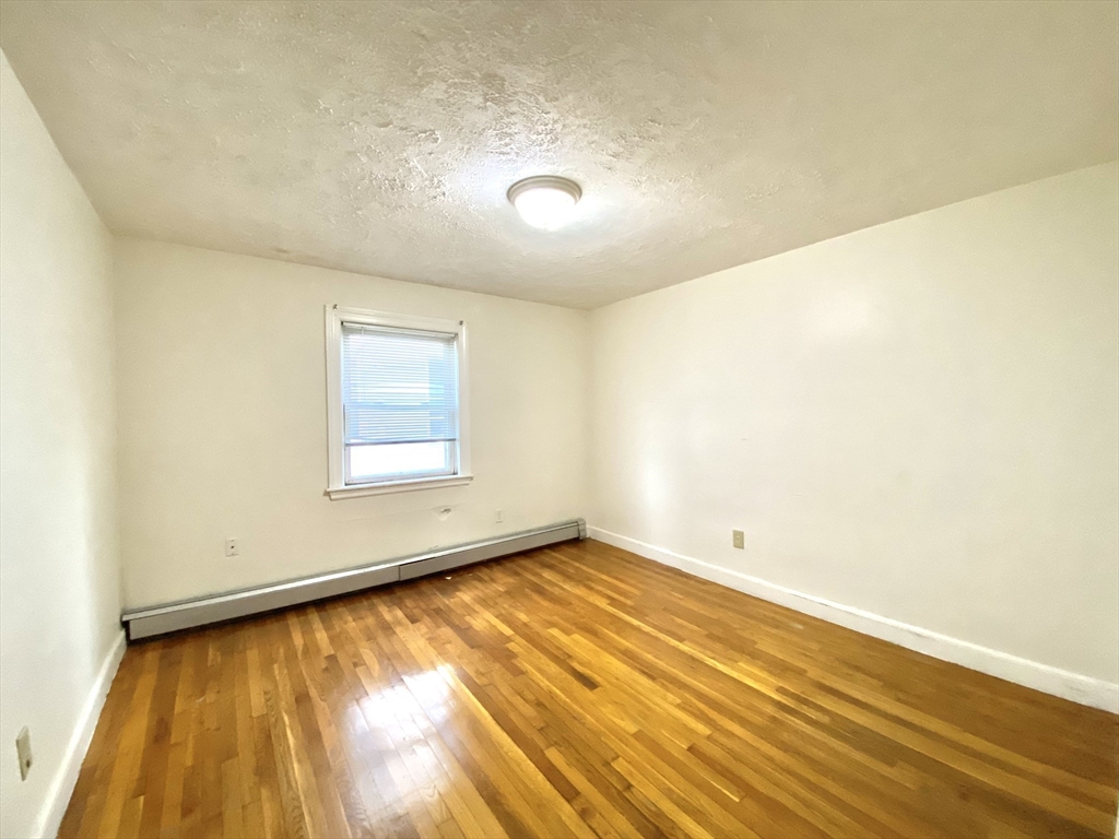 530 Beach Street, Unit 2 Revere, MA 02151 - Photo 4 of 7 an empty room with a window