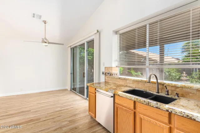 a kitchen with a sink and a window