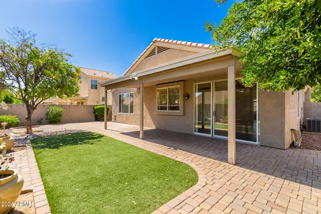 a view of a house with garden and yard